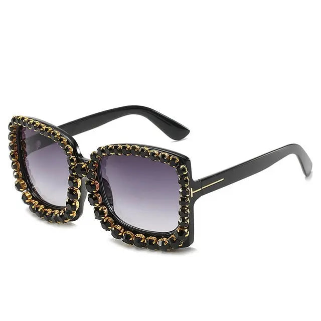 "Blockin" SunglassesExperience luxury like never before with our stunning Blockin Sunglasses adorned with sparkling diamonds. These oversized sunglasses feature a unique square frame thsunglassesK Monae'sK Monae's"Blockin" Sunglasses