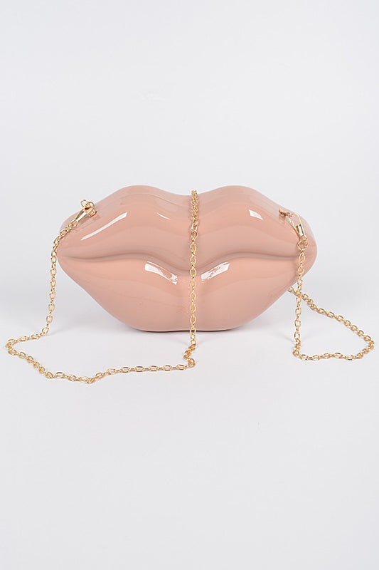 "Give Me A Kiss" HandbagThis "Give Me A Kiss" Handbag features a stylish kiss design and is available in medium size, making it a perfect companion for a date night.HandbagsK Monae'sK Monae'sKiss" Handbag